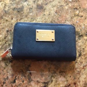 Michael Kors ladies zip wallet.